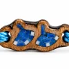 Close-up of the blue Cast Away bracelet wooden charm with blue inlay