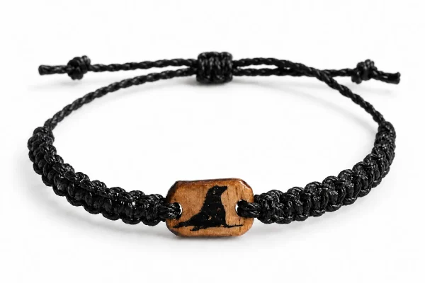 Cast Away Sea Lion bracelet in black braided cord with a wooden charm inlaid with a sea lion