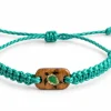Cast Away Sea Turtle bracelet in green braided cord with a wooden charm inlaid with a sea turtle