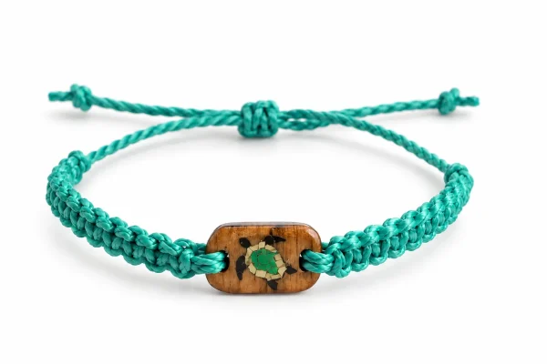 Cast Away Sea Turtle bracelet in green braided cord with a wooden charm inlaid with a sea turtle