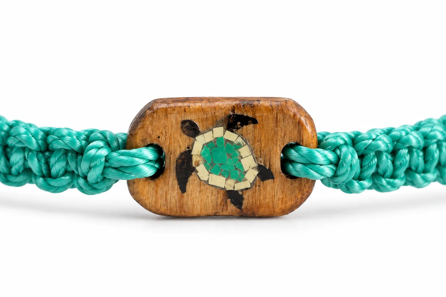 Close-up of the Cast Away Sea Turtle wooden charm with a green recycled plastic turtle inlay