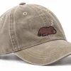 Sand cap with a sleepy sea lion embroidered on the front, side view