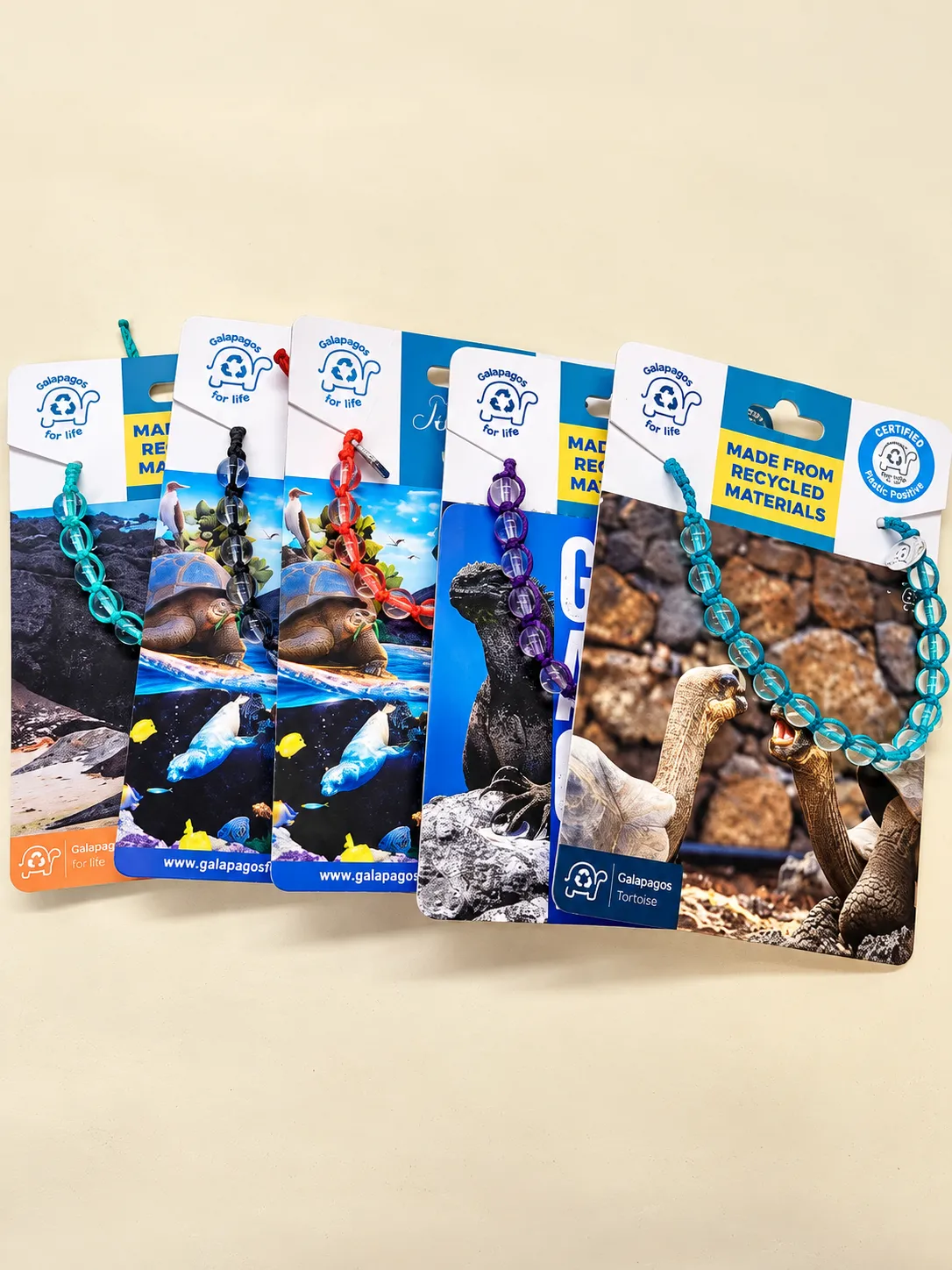 A row of illustrated bracelet cards fanned out, each with its bracelet