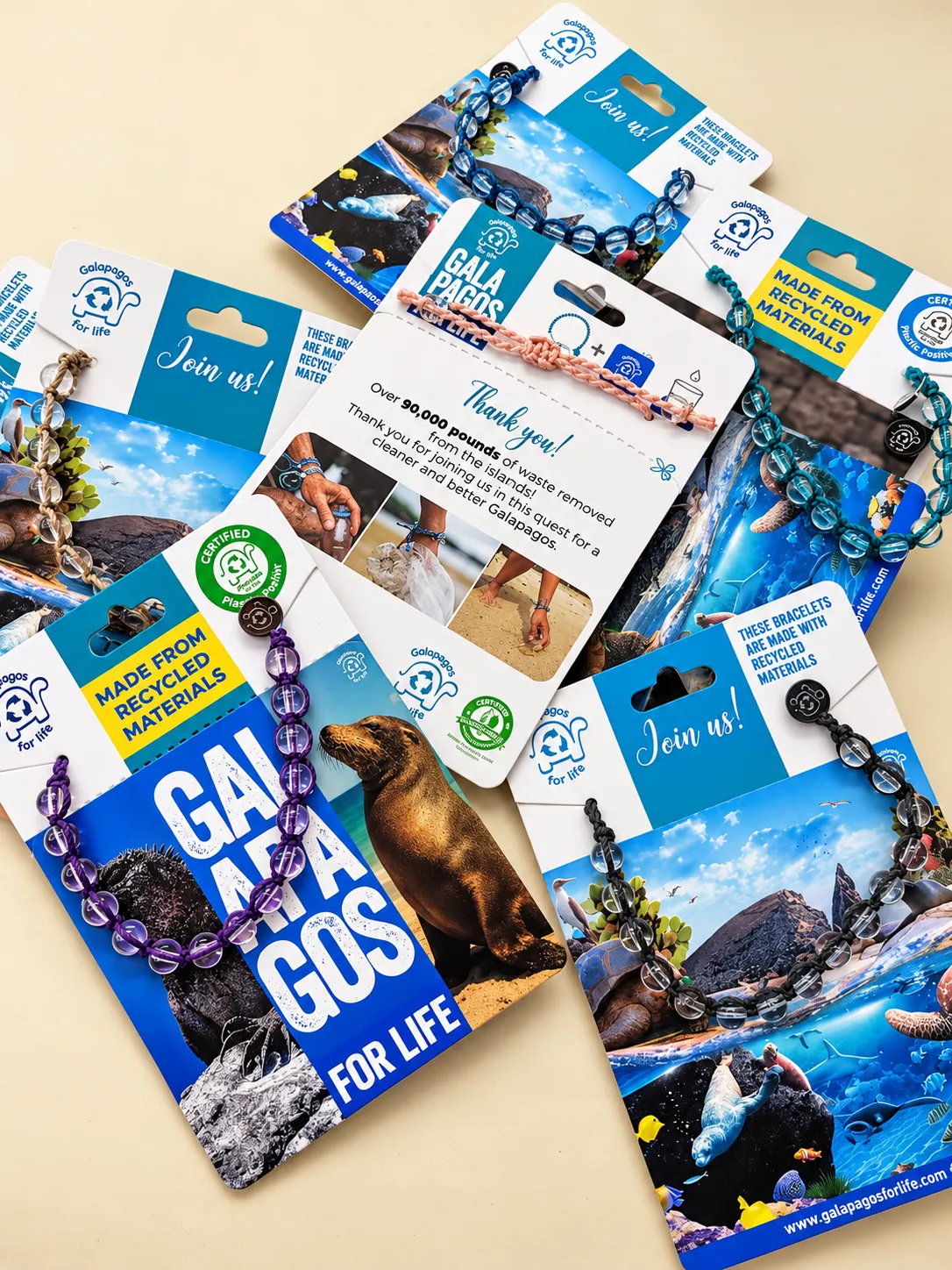 Collection of Galápagos for Life bracelet cards with bracelets in several colors